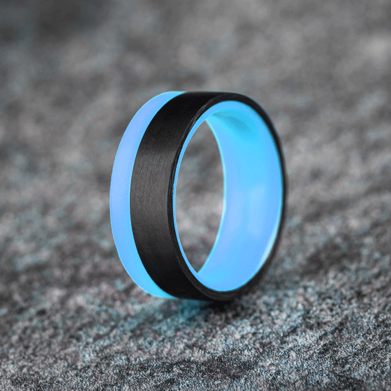 Polished 2/3 Carbon Fiber Unidirectional Ring with Pale Blue Glow Resin