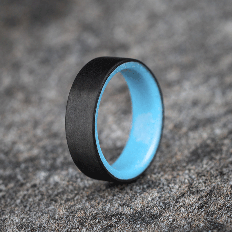 Matte Carbon Fiber Unidirectional Ring with Pale Blue Glow Resin