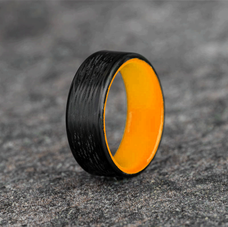 Polished Carbon Fiber Wave Pattern Ring with Orange Glow Resin