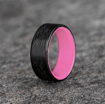 Polished Carbon Fiber Wave Pattern Ring with Pale Pink Glow Resin