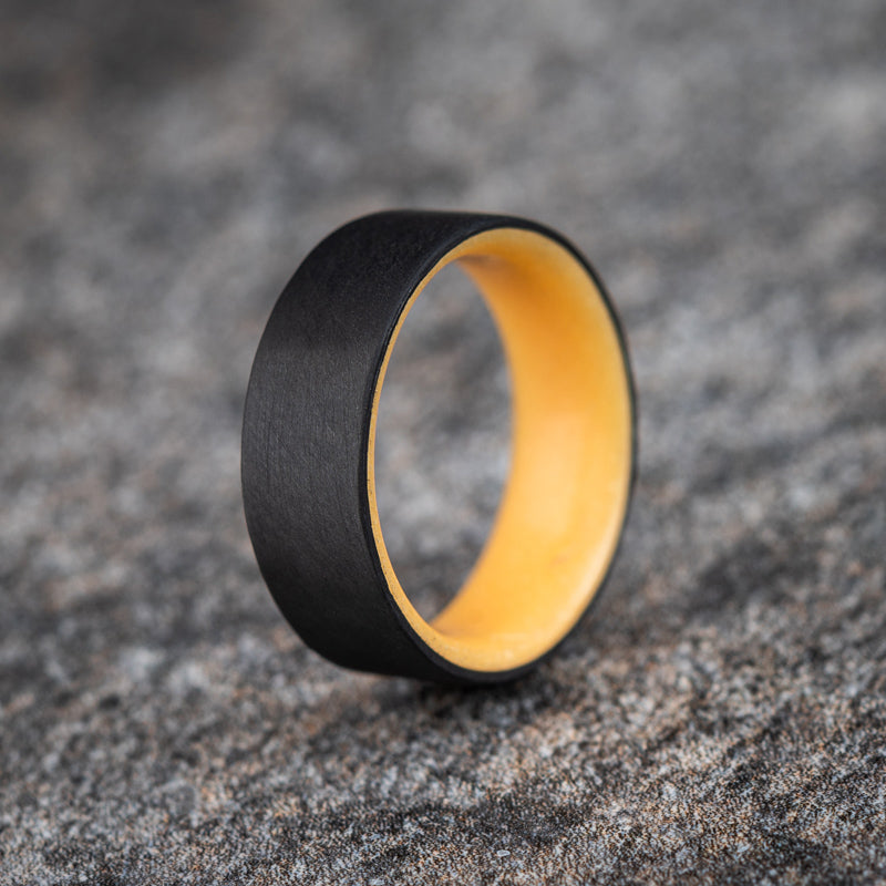 Matte Carbon Fiber Unidirectional Ring with Orange Glow Resin